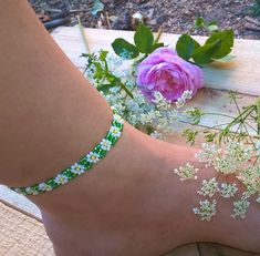 Sweet daisy anklet in green & white colors made from Czech seed beads and silver screw barrel. Looks cute with all summer outfits! This anklet measures 20 cm = 7.87 inches Green Flower Beaded Bracelets For Beach, Adjustable White Anklets For Spring, Flower Shaped Anklets For Spring Gift, Bohemian Flower Anklets For Summer, Flower Anklets For Spring, Perfect As A Gift, Handmade Adjustable Anklets For Spring, Handmade White Anklets For Summer, Adjustable Anklets For Spring Gift, Summer Festival Flower Bracelets