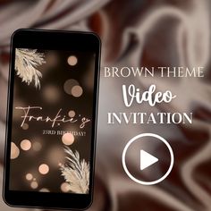 a cell phone with the text brown theme video invitation