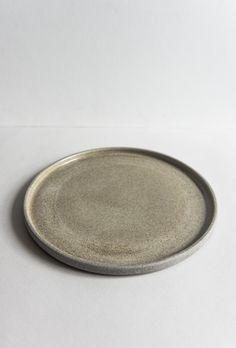 a small plate sitting on top of a white table