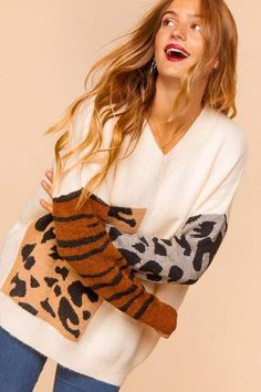 This sweater is has the softest fabric and the cutest animal print details, fits slightly oversized. 70% POLYESTER 30% ACRYLIC Winter Leopard Print Long Sleeve Sweater, Leopard Print Long Sleeve Winter Sweater, Leopard Print Long Sleeve Sweater For Winter, Long Sleeve Leopard Print Winter Sweater, Trendy Leopard Print Winter Sweater, Cute Brown Sweater For Fall, Winter Leopard Print Crew Neck Sweater, Trendy Tiger Print Tops For Fall, Trendy Leopard Print Crew Neck Sweater