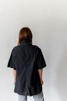 "Black short sleeve over shirt with one front chest pocket and four white buttons. Thicker over shirt material. Maker: Military | Made in USA in the 60s. Garment Dyed in Los Angeles in 2019. Material: 100% Cotton 6 oz. Condition: Excellent. may have tiny pin holes. -X SMALL- Shoulders: 17\" | Chest: 18\" | Length: 28\" | Sleeve: 10\" -SMALL- Shoulders: 17\" | Chest: 20\" | Length: 28\" | Sleeve: 10.5\" -MEDIUM- Shoulders: 18\" | Chest: 21-22\" | Length: 30\" | Sleeve: 11\" -X-LARGE- Shoulders: 2 Utility Style Relaxed Fit Tops With Side Pockets, Relaxed Fit Shirt With Side Pockets And Short Sleeves, Utility Workwear Tops With Side Pockets, Collared Shirt With Side Pockets For Work, Utility Relaxed Fit Top With Side Pockets, Relaxed Fit Short Sleeve Tops With Pockets, Collared Tops With Pockets For Everyday, Everyday Collared Tops With Pockets, Utility Camp Collar Tops For Workwear