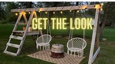 two chairs and a ladder in front of a sign with the words get the look on it