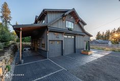 a large garage sits in the middle of a driveway