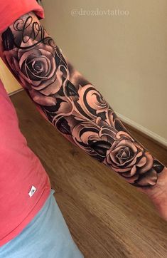 a person with a rose tattoo on their arm