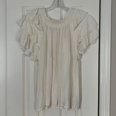 This Is Without Tags Never Worn White Luxe Feeling Shirt With Sleeve Ruffles On Shoulders Not Super Dramatic But Great Feeling Can Dress Up Or Dress Down Gap Summer Blouse For Daywear, White Gap Tops For Vacation, Feminine Ruffled Blouse For Daytime, Chic Summer Blouse From Gap, Gap Summer Blouse For A Day Out, Chic Cotton Blouse By Gap, Chic Summer Blouse By Gap, Chic Gap Blouse For Summer, White Ruffle Sleeve Tops For Vacation