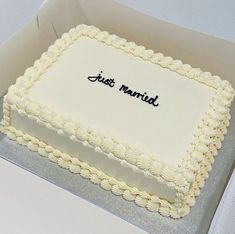 a square cake with the words just married on it