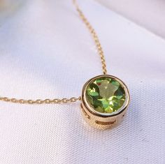 1.20 Carat Natural Peridot 14k Solid Gold Necklace Necklace Material: 14k Solid Gold  Total Metal Weight: 1.8 Grams  Gemstone: Natural Peridot Gemstone Color: Green Gemstone Shape: Round Gemstone Dimensions: 6.50x6.50mm Gemstone Quantity: 1 Gemstone Total Carat Weight: 1.20 Carat Pendant Face Measures: 8.00x8.00 mm Chain Length: 16 inch Necklace Quantity: One Pendant with a Chain Necklace Condition: New  Made in the USA Delivered in an elegant gift box 💜 JulLuxJewelry is here for You, so please Luxury Yellow Gold Gemstone Birthstone Necklace, Jewelry Redesign, Gold Necklace Pendant, Silver Gold Jewelry, 16 Inch Necklace, Peridot Jewelry, Peridot Pendant, Peridot Necklace, Gold Chain With Pendant