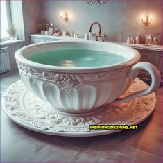 an ornate bathtub with green water in it