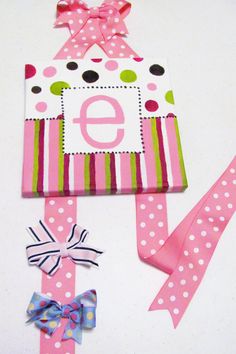 the letter e is made out of paper and ribbon