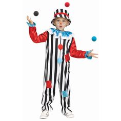 a young boy dressed as a clown juggling with balls in his hands and wearing a striped suit