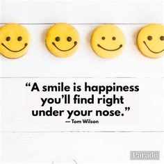 three cookies with smiley faces on them and a quote that says, a smile is happiness you'll find right under your nose