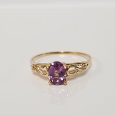 "Thanks for shopping our vintage estate store. We tend to sell well below wholesale and truly hope you enjoy all of our items. Many of the items are one of a kind, so please enjoy scrolling through the pictures and hopefully something will catch your eye. Spots are from reflections or camera. Estate 14k yellow gold created .50ct alexandrite midi or birthstone ring. The color of the gem is blue, green, to purple. No scratches on the gem. Stunning. Bought out a jewelry store that was closing and t Heirloom 14k Gold Solitaire Amethyst Ring, Classic Yellow Gold Solitaire Amethyst Ring, Classic Gold Amethyst Birthstone Ring, Classic Yellow Gold Amethyst Ring As Gift, Classic 14k Gold Amethyst Ring With Round Cut, Classic Yellow Gold Amethyst Ring With Prong Setting, Classic Gold Amethyst Solitaire Ring, Classic 14k Yellow Gold Amethyst Ring, Classic 14k Gold Amethyst Ring