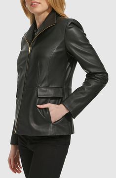 Elevate your cool-weather looks with this lambskin-leather jacket cut in a streamlined silhouette and topped with a contemporary stand collar. 25 1/2" length (size Medium) Front zip closure Stand collar Front on-seam pockets with decorative flap Lined Leather Professional leather clean Imported Sleek Leather Jacket With Zipper Closure, Sleek Formal Leather Jacket With Zipper Closure, Elegant Leather Jacket With Zip Fly, Sleek Leather Jacket With Zipper For Business, Sleek Leather Jacket With Zipper Closure For Business, Sleek Leather Jacket With Zip Fly For Winter, Collar Leather Jacket, Wing Collar, Stand Collar Jackets