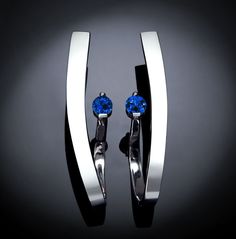 "Sapphire Earrings - Chatham Blue Sapphire - Argentium Silver  - 2001 Bold and geometric, modern and elegant, these dramatic earrings frame the face beautifully. Make a statement with this contemporary design handcrafted by award winning designer, David Worcester.  Cast in Argentium 960 premium quality, 100% recycled silver, this specially processed piece measures 37mm X 8mm or 1 1/2 inches X 5/16 inches, and is set with two beautiful 4mm Chatham Blue Sapphires. PLEASE LOOK AT THE MEASUREMENTS C Black Earrings Elegant, Earring Frame, Dramatic Earrings, Yucca Valley, Contemporary Earrings, Citrine Earrings, January Birthstone, Garnet Earrings, Ruby Earrings