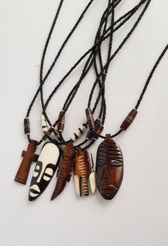 This listing is for ALL 5 African pendant necklaces like shown above. They are made using animal bones. You will get; *2 mask necklaces *Lizard *Cross *elephant Buy multiple items and pay shipping for ONE item ONLY. They ship through DHL Express. More neckleces here; https://www.etsy.com/shop/TribalTess?ref=seller-platform-mcnav&section_id=21306083 Back to my shop; https://www.etsy.com/shop/TribalTess?ref=seller-platform-mcnav African Necklaces, African Inspired Jewelry, Loc Jewelry, Mask Necklace, Bone Necklace, African Necklace, Bone Pendant, Animal Bones, Handmade Jewelry Necklace