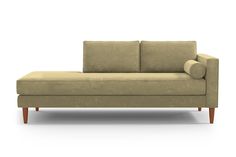 a beige couch sitting on top of a white floor