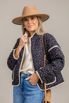 This quilted jacket is covered in a ditsy floral print, and a natural piping contrast trims the edges. The relaxed fit features hook closures down the front, a standing collar, and dropped shoulders. Patch pockets on the front complete the look. Quilted Jacket Women, Womens Quilted Jacket, Standing Collar, Ditsy Floral Print, Blue Door, Ditsy Floral, Jacket Women, Contrast Trim, Quilted Jacket