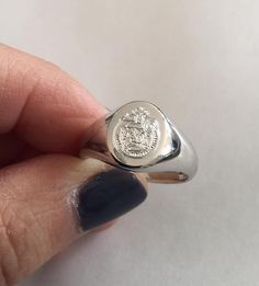 Coat of Arms Family Crest Ring, Crest Engraved ring, Personalized Ring Engraved Signet ring with Oval Seal - sterling silver - also available in Best quality 18k Gold Plate - suitable for men and women, H O W ∙ T O ∙ O R D E R 1- Make your selections (such as Material and Ring Size ) from the drop-down boxes within the listing. 2- Please leave the name of the family crest you want on the ring, or send us your image after you place your order. If you have any questions please feel free to contact Formal Oval Sterling Silver Signet Ring, Oval Sterling Silver Signet Ring For Formal Occasions, Silver Oval Signet Ring As Gift, Engraved Sterling Silver Oval Signet Ring, Silver Oval Engraved Ring With Engraving Option, Oval Sterling Silver Engraved Signet Ring, Silver Oval Signet Ring With Polished Finish, Heirloom Silver Signet Ring Stamped 14k, Silver Open Signet Ring Stamped 14k