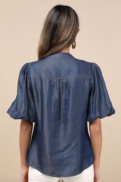 Bring a chic vibe to your everyday looks with the Lulus Contemporary Crush Dark Blue Chambray Puff Sleeve Button-Up Top! Lightweight woven chambray fabric shapes this stylish top that has pleated-like detailing at the shoulders and short puff sleeves with elastic at the cuffs. Crew neckline tops a functional, hidden button placket that runs down the bodice to rounded hems. Fit: This garment fits true to size. Length: Size medium measures 25" from shoulder to hem. Bust: Great for any cup size. Wa Chic Button-up Puff Sleeve Top For Work, Casual Button-up Puff Sleeve Top With Button Closure, Casual Button-up Puff Sleeve Top, Chic Puff Sleeve Button-up Top For Work, Casual Puff Sleeve Button-up Top, Denim Blue Button-up Workwear Blouse, Chambray Denim Blue Top With Button Closure, Chic Button-up Puff Sleeve Top With Button Closure, Denim Blue Chambray Top With Button Closure