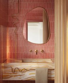 a bathroom with a sink, mirror and towel rack