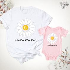 Daisy Mama Mini T-Shirt, Mama And Me Groovy Daisy Flower Shirt, Mom Baby Matching Birthday Party Shirts, Mama And Mini Tees, Mothers Day Tee. Hello, Welcome to Blue Unique Boutique, your destination for unique and handcrafted shirts! I'm Eve! I have been thinking about creating my business for a long time and now I have taken the first step towards it and it gives me excitement. As a small business, I take pride in creating unique designs from the comfort of our homes. Each shirt is carefully cr White Cartoon Print T-shirt For Spring, Family Matching White T-shirt With Cartoon Print, White T-shirt For Summer Gift, White T-shirt With Cartoon Print For Spring, Pink T-shirt With Name Print For Summer, Summer Pink T-shirt With Name Print, Pink Birthday Shirt For Summer, Pink Summer Birthday Shirt, White T-shirt For Mother's Day Gift