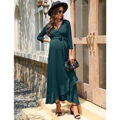 This dress features a V-neck, 3/4 sleeves, ruffled hem, and belt, offering a stylish and functional design suitable for breastfeeding. The V-neck and sleeves enhance your style and are convenient for nursing, while the belt accentuates the waistline. The flowing skirt, knee-length cut, and soft fabric ensure both beauty and comfort. Made of 60% polyester, 35% rayon, and 5% spandex, the dress is versatile for matching with various accessories and suitable for different occasions such as dates, va Maternity Dress Casual, Maternity Dresses Casual, Maternity One Piece Swimsuit, Maternity One Piece, Ruffle Long Dress, Female Features, Maternity Dresses Summer, Breastfeeding Dress, Maternity Wardrobe