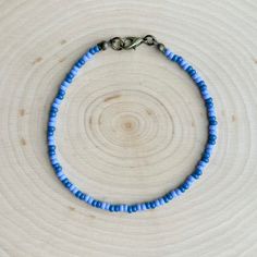 This is the Blueberry Beaded Anklet.  It is super cute, with lots of blueberry vibes!  This anklet is beautiful and elegant, yet also great for everyday casual wear. - It is fastened with antiqued bronze coated brass pieces, and is made with durable native glass seed beads. - My beads are always purchased here in Oklahoma from local native sellers. - It is 8.5" long with options for a 1" or 2" extender chain making it up to 10.5" long. *Note: Due to differences in device screens, the colors may Purple Tiny Beads Bracelets For Beach, Purple Beaded Bracelets For Beach With Tiny Beads, Purple Beaded Bracelets With Tiny Beads For Beach, Trendy Colorful Beaded Anklets As Gift, Blue Beaded Chain Bracelets For Beach, Trendy Round Bead Anklets For Gift, Adjustable Purple Beaded Bracelet With Beaded Chain, Adjustable Purple Beaded Chain Bracelets, Adjustable Purple Beaded Chain Bracelet