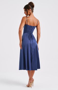 The dreamy Deanna dress is ultra feminine. made in our premium woven cotton blend fabric that feels as good as it looks. Featuring a corseted bodice with boning to cinch the waist. the bust is gathered with a drawstring tie for a super pretty finish. The midi skirt is complete with a thigh high split for a little bit of sexiness. Style it up with an effortless knot and heeled mules.   Colour: Navy. Premium woven cotton blend fabric. Fully lined. Boning in bodice. Gathered. underwired cups. Tie b Homecoming Dresses Corset, Midi Dress Wedding Guest, Long Sleeve Homecoming Dresses, Maxi Dress Sale, Cotton Blend Fabric, Sparkle Dress, Navy Midi Dress, Dresses By Length, Formal Dresses Prom