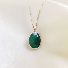 This stunning Pendant is set in 14k Solid Yellow Gold with Natural Emerald with utmost precision. It is a unique gemstone Pendant for nearly every occasion and is completely hassle-free jewelry. ITEM DETAILS: * GEM: Emerald * GEM SIZE: 11x15mm * GEM SHAPE: Oval * Gem weight: 9.30 carats * Gold Purity: 14KT  * Gold Weight: 0.56 gram * Total Weight of the Pendant: 2.42 gram The Gold purity is guaranteed and it comes with authentic 14KT gold hallmark. Since my items are handmade, they are absolutely nickel and lead free. CUSTOMIZATION: * Gemstone customization is available and it can be substituted with a gem of your choice. Kindly message me for the same. PACKAGING * The Pendant comes with layers of safe and secure wrapping along with Free handmade jewelry box with every purchase. ➡️Head to Oval Emerald Pendant, Jewelry Emerald, Handmade Jewelry Box, Emerald Gem, Wardrobe Wishlist, Zodiac Signs Gemini, Emerald Pendant, Anniversary Jewelry, May Birthstone