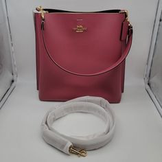 Brand: Coach Style: Mollie Bucket Bag / Ca214 Condition: New With Tag Exterior Color: Rouge Interior Features: Middle Zippered Compartment Closure: Magnetic Snaps Hardware Color: Gold Straps: One Short Handle And One Crossbody/Shoulder Strap Approx. Measurements: 11" L X 11.5" H X 3.75 W Includes: Coach Hangtag No Lowball Offers Or Trades Please. I Do Not Discuss Prices On Listings. Thank You For Looking! Pink Bucket Bag With Detachable Handle For Formal Occasions, Pink Formal Bucket Bag With Detachable Handle, Formal Pink Bucket Bag With Detachable Handle, Luxury Square Bucket Bag For Formal Occasions, Pink Formal Bucket Shoulder Bag, Pink Formal Shoulder Bucket Bag, Formal Pink Shoulder Bucket Bag, Formal Pink Top Handle Bucket Bag, Elegant Pink Bucket Bag For Formal Occasions