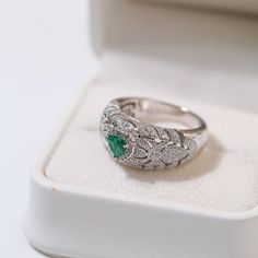 Featuring a heart-shaped emerald centerpiece surrounded by a dazzling halo of diamonds, this delicate ring embodies the essence of vintage elegance. The rich green color of emeralds symbolizes love and vitality, while sparkling diamonds add a touch of glamor. Metal: 18ct Recycled White Gold Plated On Recycled Sterling Silver Gemstone: Cubic Zirconia,Artificial Emerald Gemstone Ring Dimensions: High 10mm Ring Sizes Available: US 6, 7, 8, 9 Weight: 7g Luxury Green Heart Cut Rings, Exquisite Green Emerald Ring With Pave Setting, Classic Green Halo Ring With Diamond Accents, Green Diamond Rings With Pave Setting, Exquisite Green Jewelry With Pave Setting, Green Emerald Ring With Diamond Accents, Green Emerald Diamond Ring With Accents, Green Diamond Rings With Diamond Accents, Green Diamond Rings With Accents