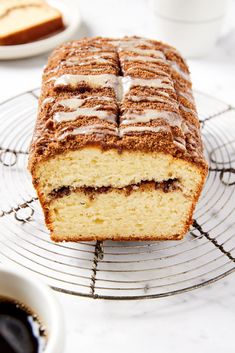 a loaf of cake sitting on top of a cooling rack