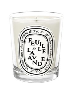 a small glass candle with the words po mandere on it's side