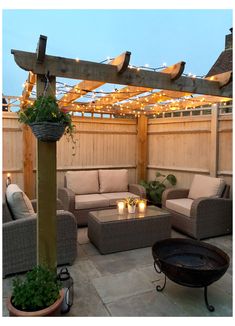 an outdoor living area with furniture and lights