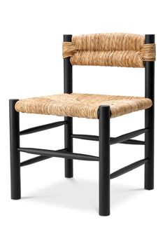 a chair made out of wicker and black metal