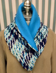 a blue and white scarf on top of a mannequin