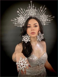 Festive silver halo crown with snowflakes. It will be a great addition to a festive outfit for a Christmas party or New Year's celebration. Will be a great addition to winter photography. The height of the composition is 6,9 inches. The size of the product is adjustable using an elastic band that connects the sides of the headband. 100% designed and handmade by our designers ( SETA Design studio in Kyiv). It will be securely packed in a box. Feel free to contact us if you have any questions. We accept returns only if the product is delivered to the buyer in a damaged condition. The buyer must contact us on the day of receiving the parcel and provide photos confirming the damage to the product. We do not accept order cancellations if the product has already been sent to the buyer. For all c Christmas Headdress, Bride Winter, Christmas Headpiece, Christmas Party Accessories, Fairy Headpiece, Crown Bride, Belly Dancer Costumes, Spring Portraits