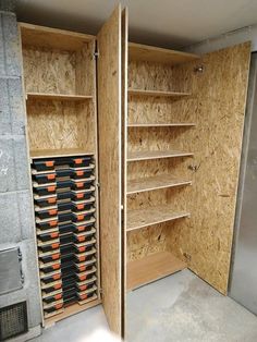 a room that has some shelves and other items in it, with one door open