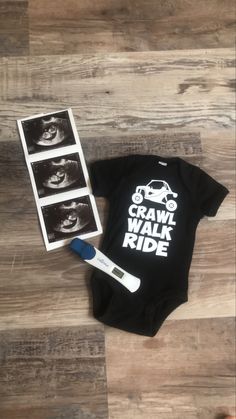 an infant's bodysuit with the words crawl walk ride printed on it next to a toothbrush