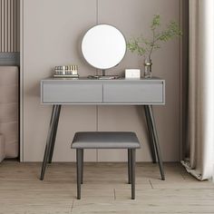 a dressing table with a mirror and stool