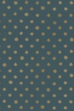 a blue and gold wallpaper with small white stars on it's side,