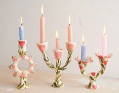 a group of candles sitting next to each other