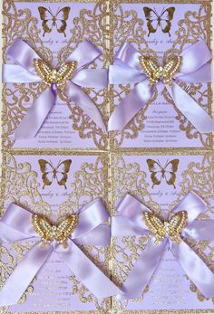 the wedding card is decorated with purple and gold ribbon, butterflies and pearls on it