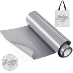 a roll of silver colored paper next to a bag