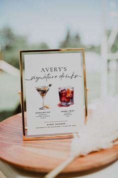 there is a sign that says avery's signature cocktails on the wooden table