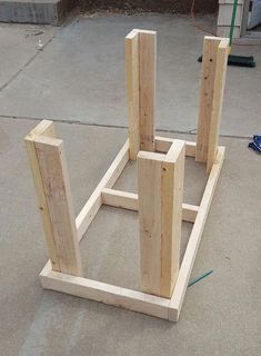 two wooden structures are sitting on the ground