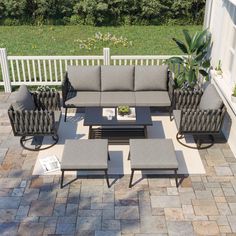 an outdoor patio furniture set with grey cushions