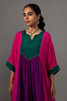 Rani pink and purple silk colour block panel kurta with gotapatti work. Comes with pant.
Components: 2
Type Of Work: Gota Lace
Neckline: Round
Sleeve Type: Three quarter
Fabric: Pure Silk
Color: Pink,Purple
Other Details: 
Length: Kurta: 42 inches
Weight: 1 kgs
Closure: Pant: Drawstring
Occasion: Mehendi and Haldi - Aza Fashions Gotapatti Work, Rani Pink, Pant For Women, Lace Neckline, Kurta With Pants, Purple Silk, Type Of Pants, Colour Block, Aza Fashion