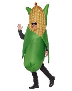 a man in a corn cob costume walking with his hand out to the side