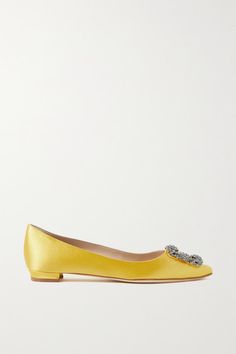 Manolo Blahnik discovered the beautiful crystal-embellished buckle (that's become nothing short of iconic) in Italy, where his designs are also meticulously crafted. These 'Hangisi' flats are made from lustrous yellow satin with leather linings and soles. Take a cue from stylist and influencer Emili Sindlev, who likes to match the shade of her Manolo's to her accessories. -- Heel measures approximately 10mm/ 0.5 inches - Yellow satin - Slip on - Made in Italy Elegant Crystal Embellished Ballet Flats For Evening, Elegant Embellished Ballet Flats, Embellished Elegant Ballet Flats, Elegant Embellished Flat Ballet Flats, Elegant Embellished Ballet Flats For Formal Occasions, Chic Embellished Ballet Flats, Elegant Embellished Ballet Flats For Party, Spring Formal Embellished Ballet Flats, Chic Embellished Evening Flats